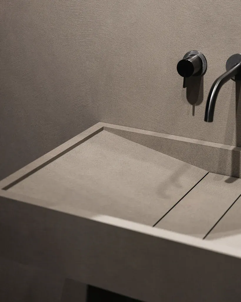 Fluted marble effect tiles behind a tap